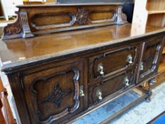 PRIORY-STYLE OAK SIDEBOARD with stage back, drawers and cupboards, 151cms wide