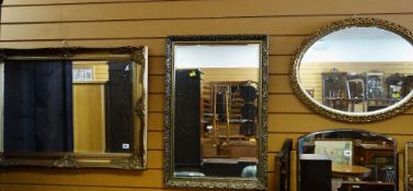 FOUR MODERN DECORATIVE GILT GESSO MIRRORS including an oval example (4)