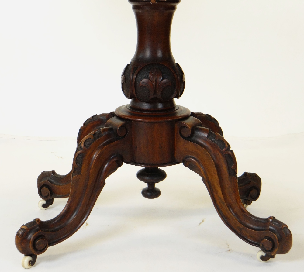 MID-VICTORIAN CARVED WALNUT SERPENTINE CARD TABLE, foldover top above baluster column and four - Image 2 of 3