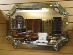 EARLY 20TH CENTURY BRASS FRAMED CANTED RECTANGULAR WALL MIRROR, 88cms wide