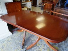 REPRODUCTION GEORGE III-STYLE TWIN-PEDESTAL EXTENDING DINING TABLE with ebony strung edge with three