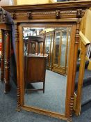 EARLY 20TH CENTURY MEDIEVAL-STYLE OAK OVERMANTEL MIRROR, ogee cornice with four carved masks,