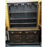 18TH CENTURY WELSH OAK HIGH DRESSER, the boarded delft rack with card cut and hollow cornice