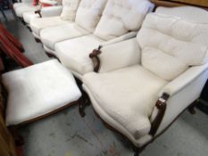CARVED VICTORIAN-STYLE WALNUT ARMCHAIR, loose cushions, and similar large footstool (2)
