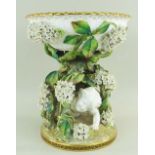 MOORE BROS PORCELAIN CENTREPIECE COMPORT modelled as a basket, supported by white flowers and a