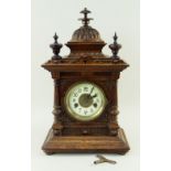 LATE 19TH CENTURY WALNUT CASED ARCHITECTURAL MANTEL CLOCK with cupola and turned finial surmount,