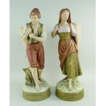 PAIR ROYAL DUX PORCELAIN FIGURES, modelled as rustics carrying panniers, impressed numerals 2363 and