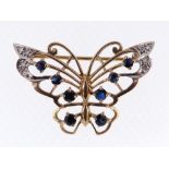 9CT GOLD BAR BROOCH of butterfly design set with eight sapphires and diamond chips, 4.8gms