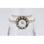 18CT GOLD PEARL & DIAMOND CLUSTER RING, the central pearl surrounded by twelve diamonds, ring size Q