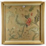 DECORATIVE WOOLWORK PICTURE, depicting wild flowers including wild rose, knapweed ETC on brown