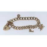 9CT GOLD CURB LINK CHARM BRACELET, c. 1972, suspending three charms: Welsh Dragon, St. Christopher