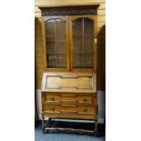 REPRODUCTION OAK BUREAU BOOKCASE in the 17th Century style, astragal glazed cabinet doors above