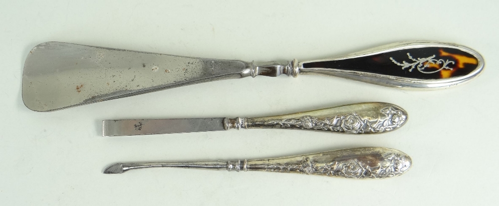 SILVER VANITY ITEMS comprising silver and tortoiseshell shoe horn, silver handled matching