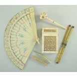 SMALL GROUP OF ANTIQUE IVORY ITEMS including Indian pierced filigree card case, a fan, propelling