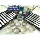COLLECTION OF BOXED TABLEWARES & SILVER NAPKIN RINGS, including set of 6 George V silver teaspoons