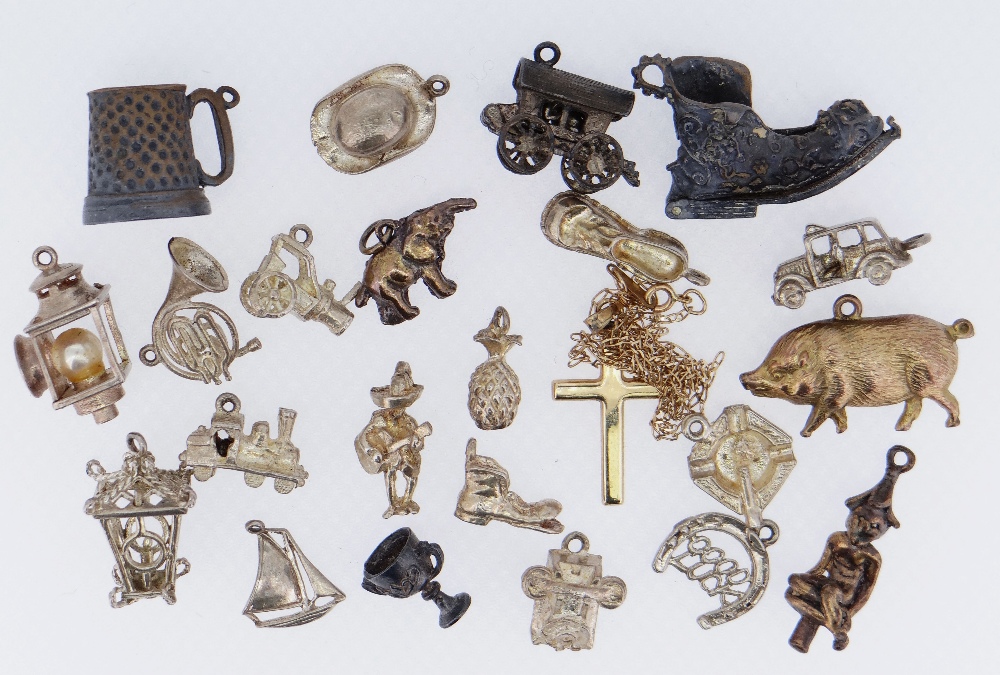 ASSORTED CHARMS in white and yellow metal including animals, car, shoe, lanterns ETC together with a