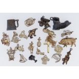 ASSORTED CHARMS in white and yellow metal including animals, car, shoe, lanterns ETC together with a