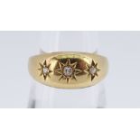 18CT GOLD THREE STONE DIAMOND RING, gypsy set, size L / M, 3.4gms