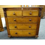 LATE VICTORIAN OAK CHEST fitted two short and three long graduated drawers, foliate corbels (feet