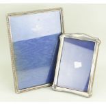 TWO SILVER PHOTOGRAPH FRAMES, one large and one medium both of easel design (2)