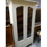 MODERN WHITE PAINTED PROVINCIAL FRENCH STYLE VITRINE, ogee cornice above shaped glazed doors