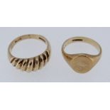 TWO 9CT GOLD RINGS comprising a ridged example and a signet ring, sizes M and I / J, 9.2gms