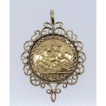 EDWARD VII GOLD SOVEREIGN, 1907, in 9ct gold scroll design mount, 12.7gms