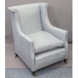 CIRCA 1900 SALON ARMCHAIR nicely reupholstered in blue fabric, raised on brass castors, 93cms H,