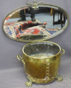 GEORGIAN STYLE BRASS LOG BIN and a vintage oval metal framed mirror, the log bin with twin handles