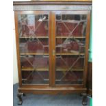 EDWARDIAN DISPLAY CABINET with twin astragal glazed doors on ball and claw feet, 186cms H, 132cms W,
