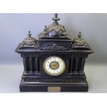 LATE VICTORIAN SLATE ARCHITECTURAL MANTEL CLOCK with decorative metal mounts and presentation plaque