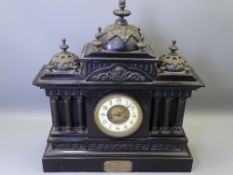 LATE VICTORIAN SLATE ARCHITECTURAL MANTEL CLOCK with decorative metal mounts and presentation plaque