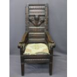 HEAVILY CARVED WELSH EISTEDDFOD TYPE CHAIR, three feathers and 'Ich Dien' carved to the back
