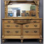 CIRCA 1900 STRIPPED WALNUT MIRROR BACK SIDEBOARD having a bevelled edge mirror flanked by turned and
