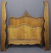 CONTINENTAL OAK 4FT 6INS BED FRAME, the shaped head and foot boards with carved detail, 159cms H,