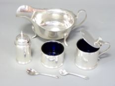 SHEFFIELD 1952 SAUCE BOAT and Birmingham 1920 three piece condiment set, maker's Emille Viner, 15cms