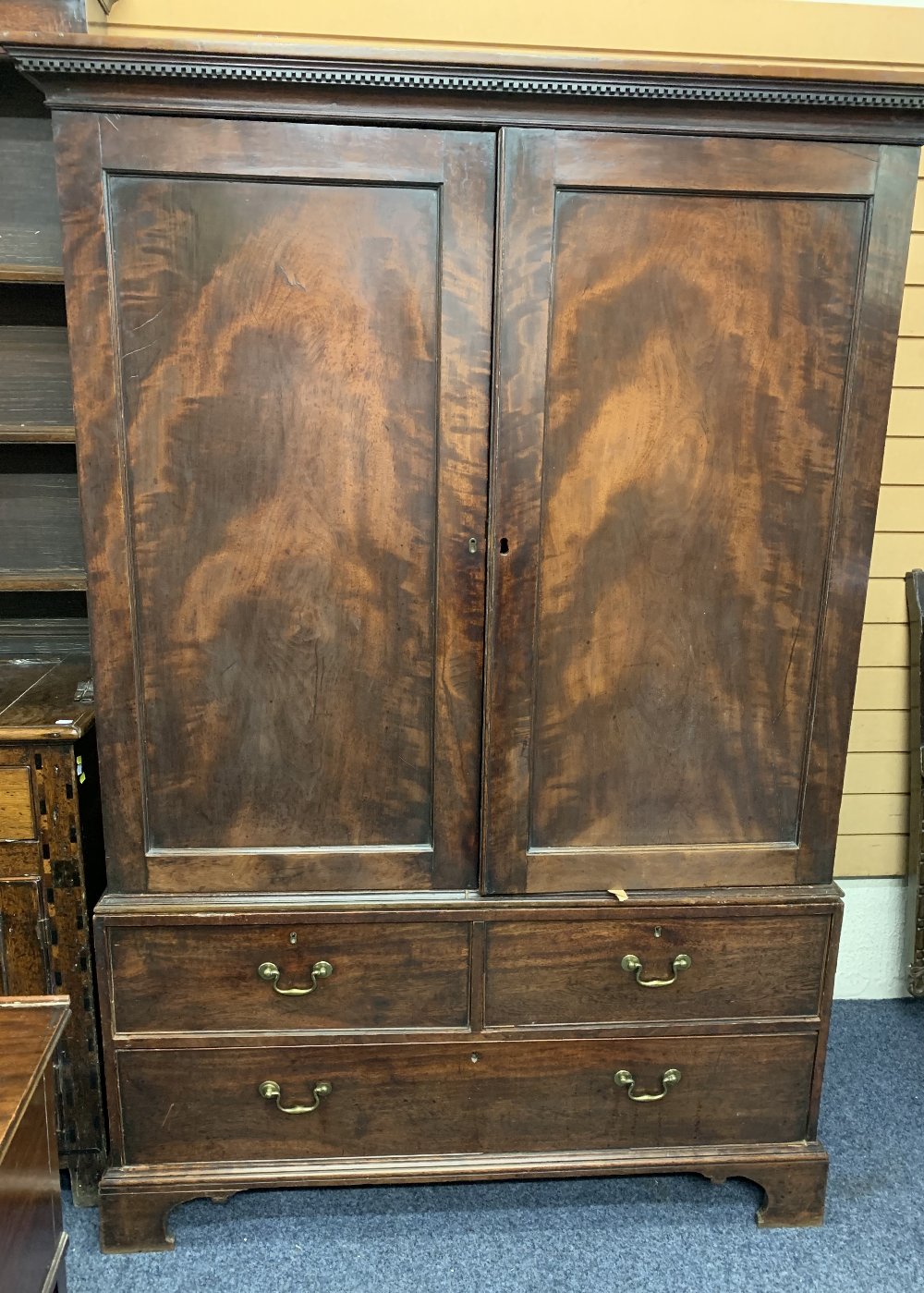 CIRCA 1900 PRESS CUPBOARD, two doors above two long drawers with shelved interior and dentil