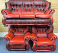 VINTAGE BUTTON BACK RED LEATHER EFFECT THREE PIECE SUITE of three seater settee and a pair of