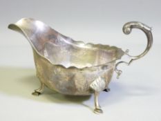 HOOF FOOTED SILVER SAUCE BOAT with C scroll handle, Birmingham 1921, Maker Williams (Birmingham)