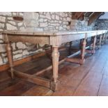 CIRCA 18TH CENTURY & LATER 20FT LONG REFECTORY TABLE on turned supports with cross stretchers, 71cms