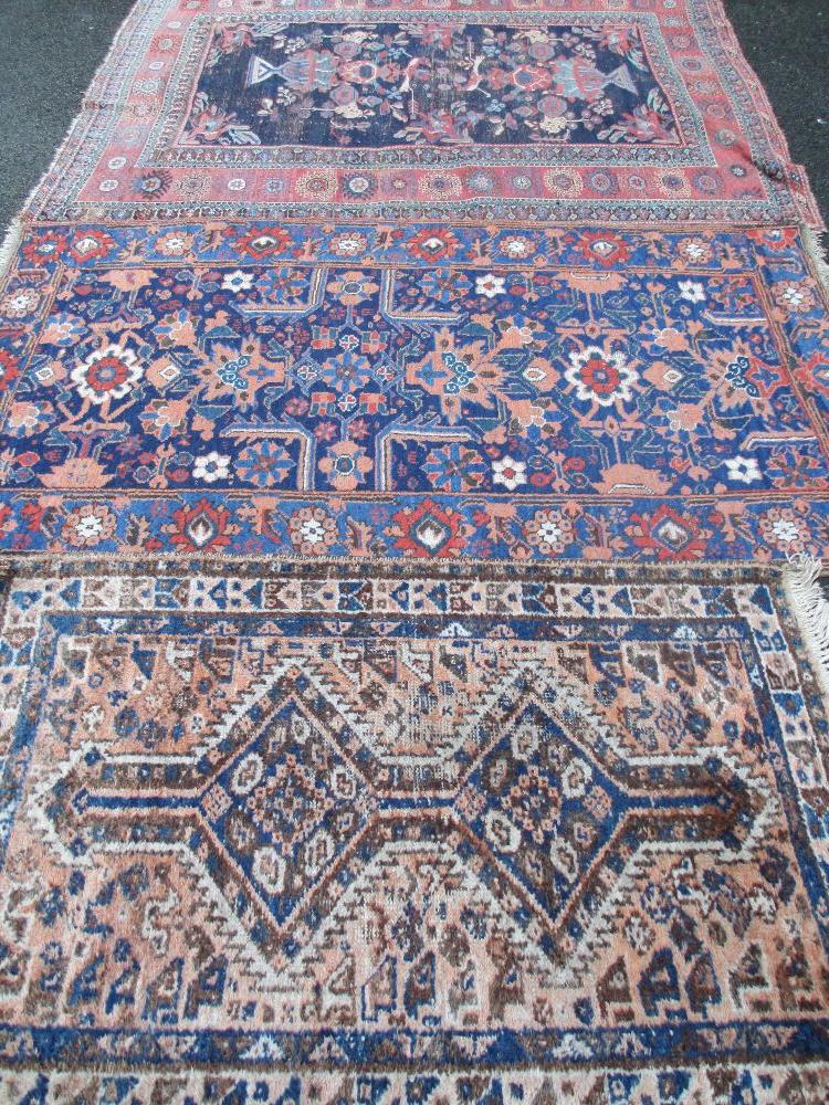 RUGS - three Eastern, various designs, 210 x 160cms, 207 x 112cms and 150 x 100cms