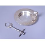 ARTS & CRAFTS SUGAR TONGS and a modern circular dish with dolphin handle, Chester 1906, Maker W J