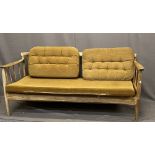 DANISH STYLE TEAK SPINDLE BACK SETTEE with unusual lift and drop-down arm, 68cms H, 166cms W,