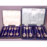 CASED SILVER TEASPOONS, two sets including a large set of six with sugar tongs by Walker & Hall