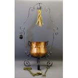 WROUGHT IRON CAULDRON STAND with copper swing-handled cauldron and a selection of brassware