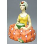 HENRI DELCOURT PORCELAIN INK WELL in the form of a seated woman with turban holding a bowl for the