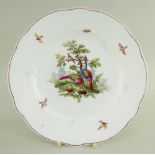 A NANTGARW PORCELAIN PLATE of shaped circular form, decorated in the Chelsea style with a scene of