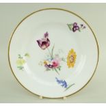 A SWANSEA PORCELAIN FLORAL DECORATED PLATE with off-centre spray of flowers and outer sprigs