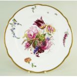 A NANTGARW PORCELAIN PLATE WITH LARGE SPRAY OF FLOWERS of lobed circular form and with gilded rim,