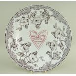 A RARE YNYSMEUDWY POTTERY ADVERTISING DINNER PLATE FOR HUZZEY'S in the Alma transfer of trailing